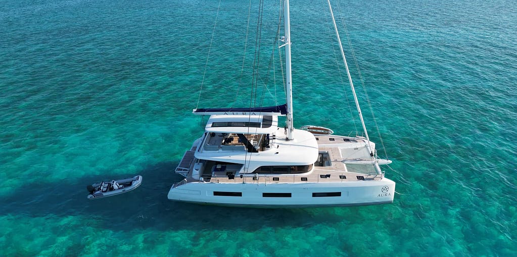 Charter Catamaran AURA Accommodates 8 guests in 4 cabins. All Inclusive week charters in the BVI starting at $42,000. With Captain & Chef.