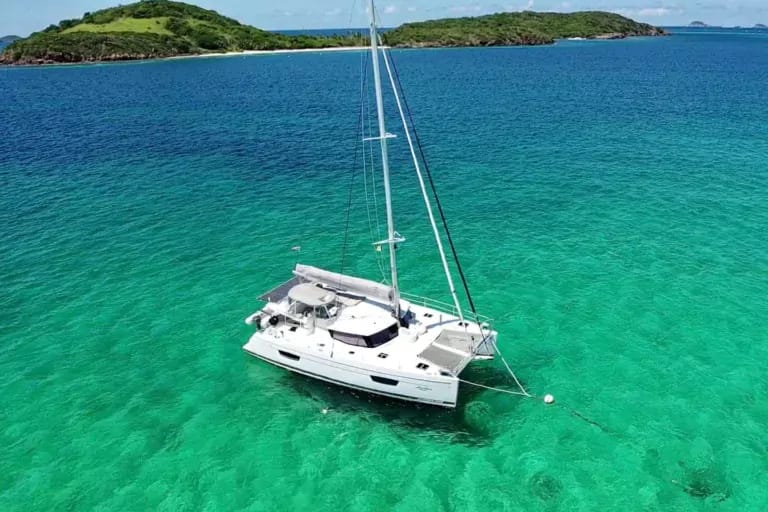 Charter Catamaran Abundance, accommodates 4 guests in 2 ensuite cabins. Permanent charter crew of 2. 7 nights all inclusive BVI Charter. Crewed Charter BVI.